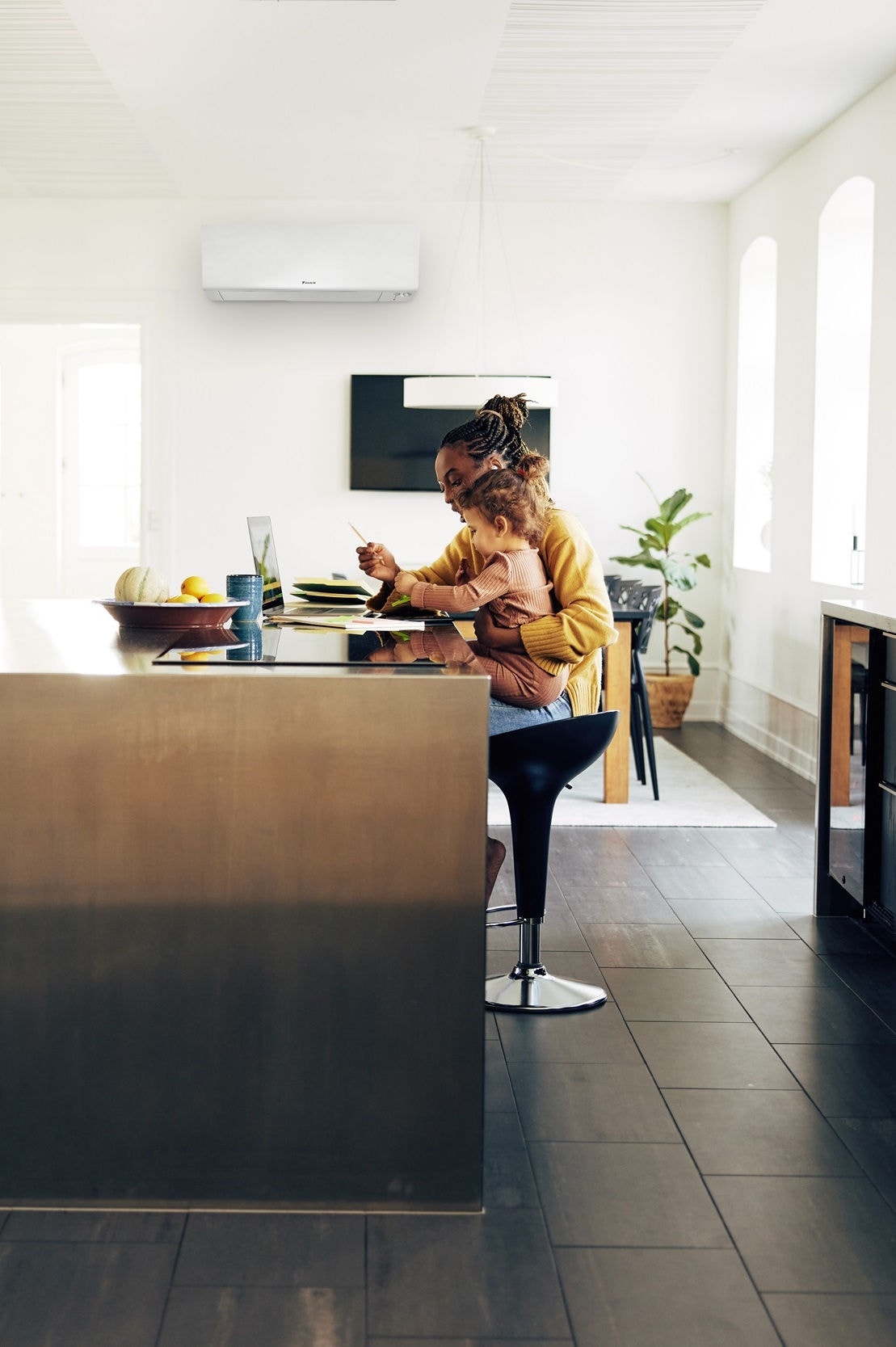 Couple with kid relaxing in bedroom enjoying clean air with air purifier