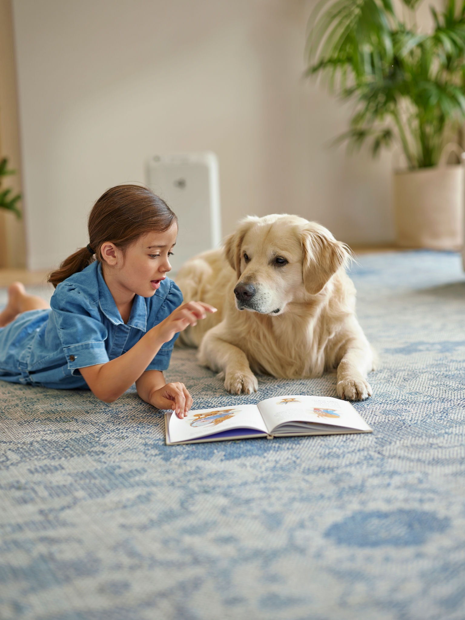 Child and pet enjoying clean air free from pet hair, dander and odours