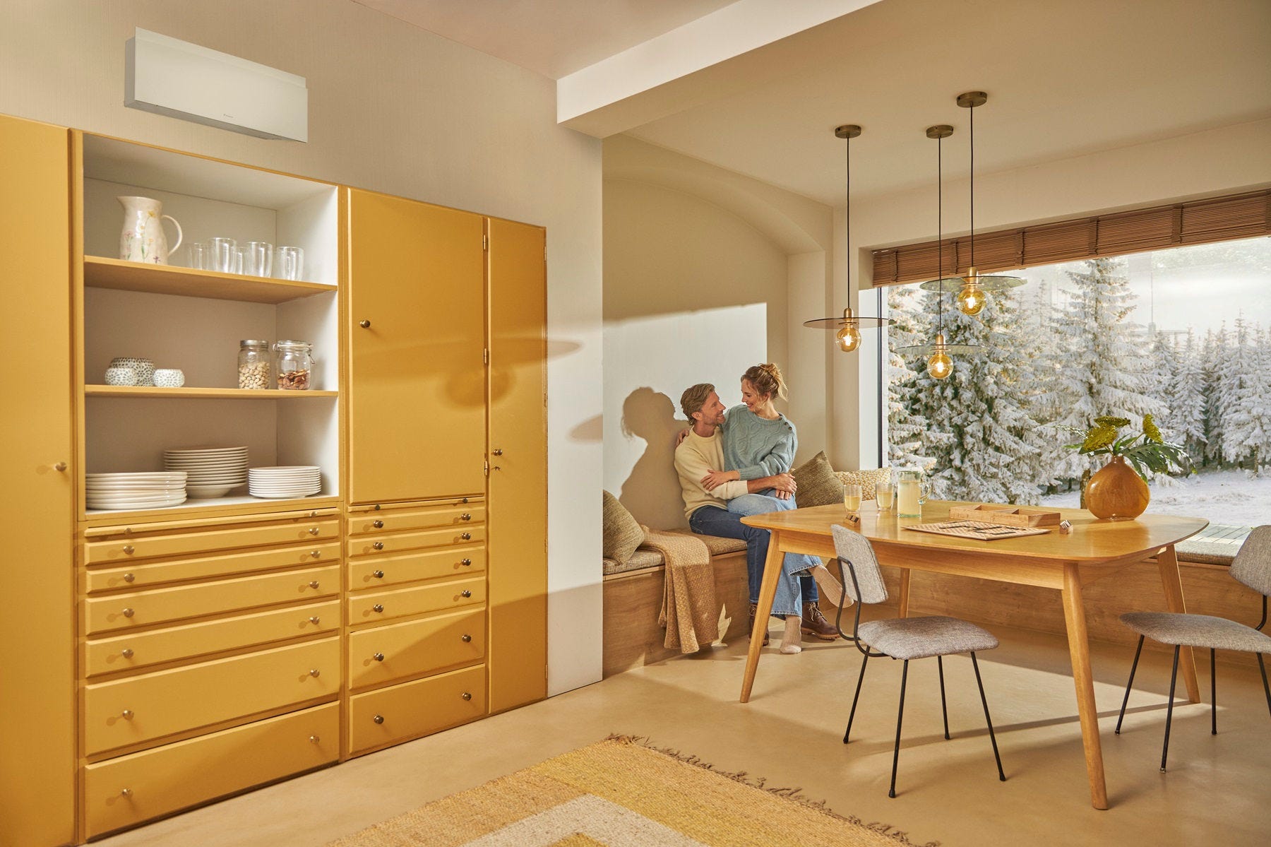 Pregnant lady on couch enjoying heating with air conditioner