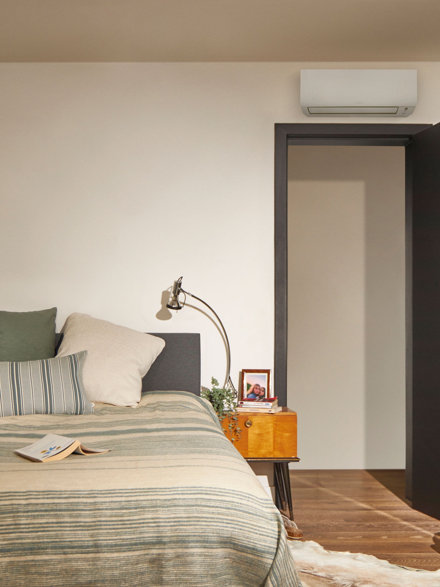 Cozy bedroom heated by a heat pump, ensuring energy savings and comfort