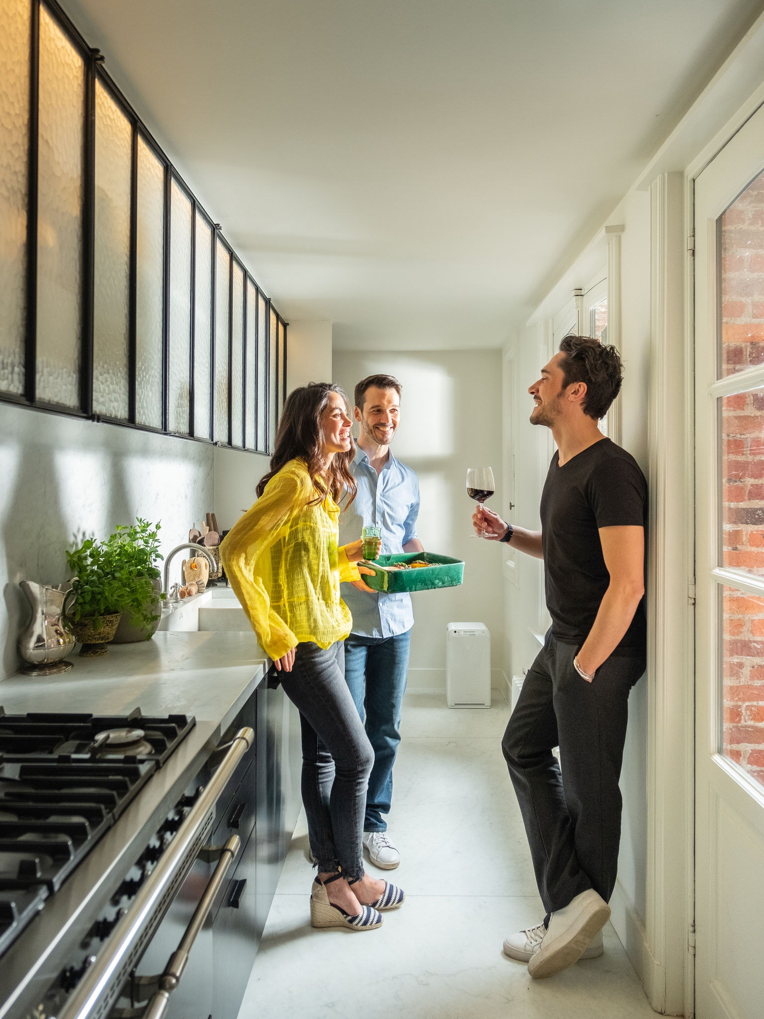Friends in gully kitchen with Air Purifier in background