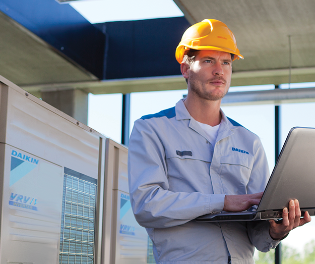 An installer installing an indoor unit